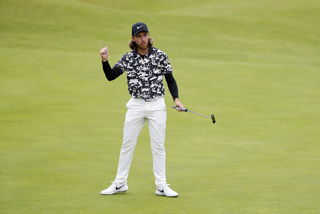 Tommy Fleetwood celebrates holing a putt in round two of The 148th Open